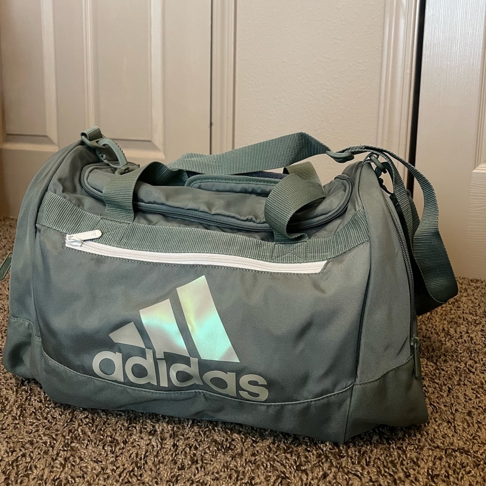 Light aqua colored Adidas small duffel bag
